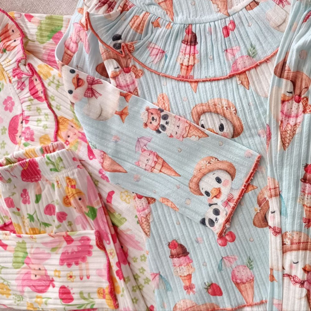 Girls' matching blouse and pants set, suitable for ages 2 to 9 years old.