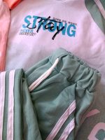 T-shirts and pants for girls and boys, 4 to 7 years old.