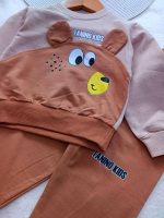 Girls' and boys' tops and trousers, ages 1 to 5 years