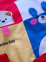 Girls' and boys' blouse and trousers, sizes 45 and 50
