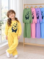 Girls' blouse and trousers, ages 7 to 11