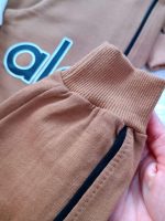 Girls' and boys' blouse and trousers, sizes 45 and 50